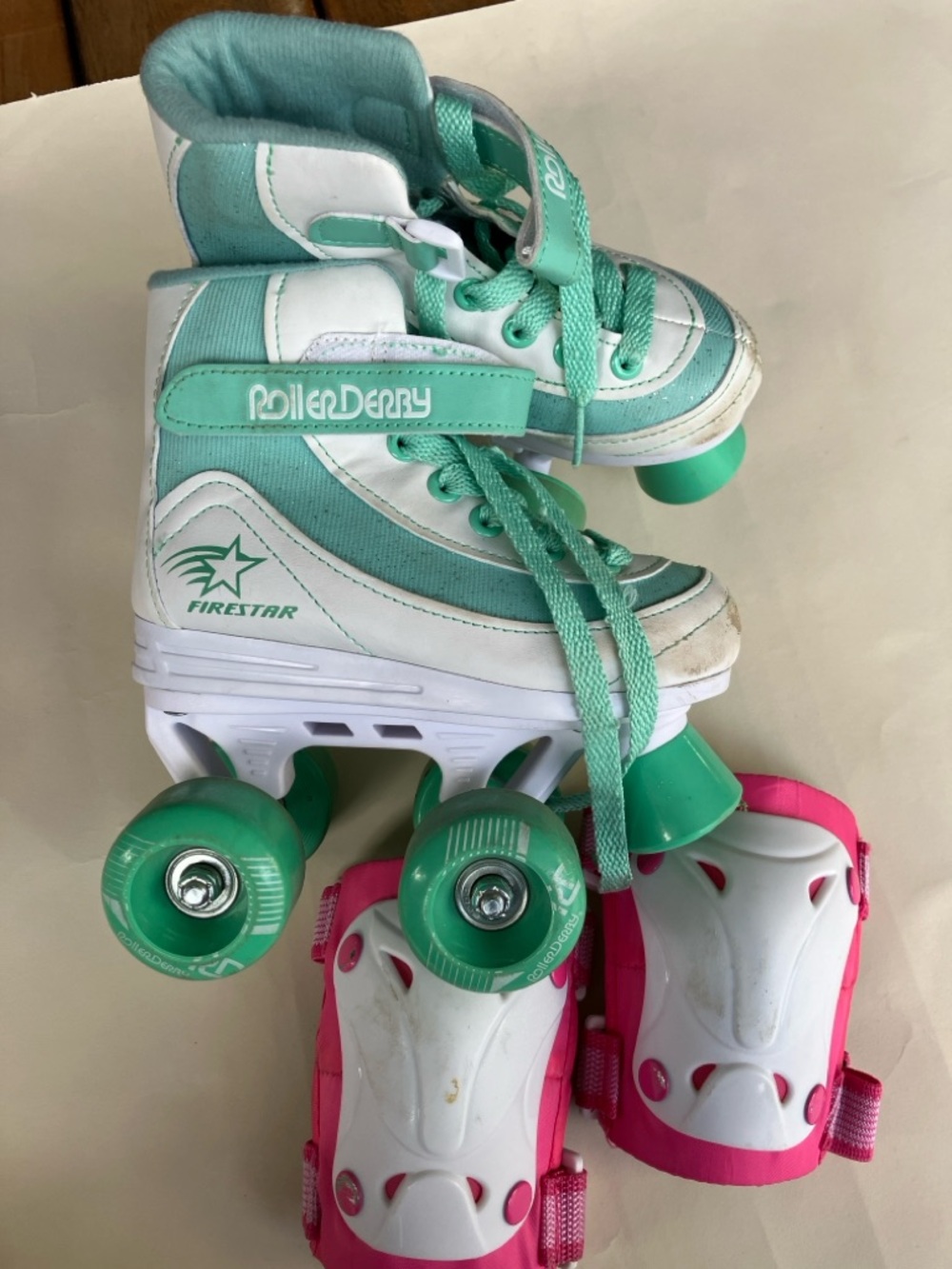 Teal and White Junior 12 Roller Skates
